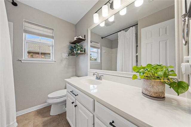 bathroom featuring vanity, walk in shower, tile patterned floors, and toilet