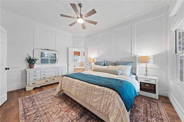 bedroom featuring dark wood-type flooring, ceiling fan, and ornamental molding