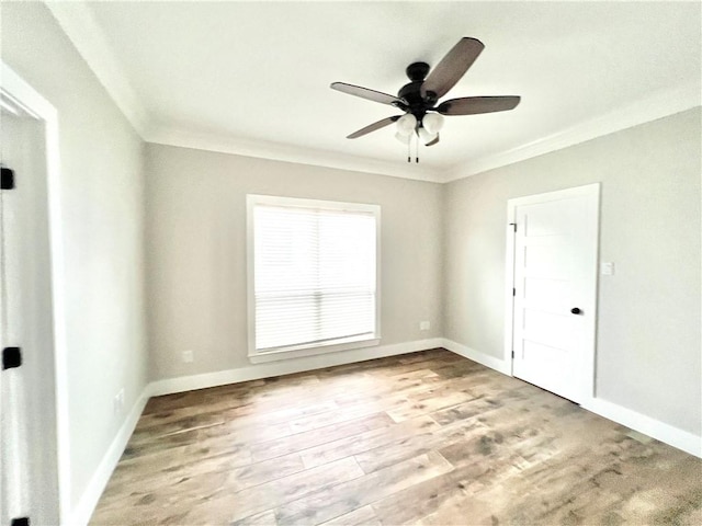 empty room with crown molding, light hardwood / wood-style flooring, and ceiling fan