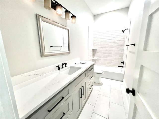 full bathroom featuring tile patterned floors, vanity, toilet, and tiled shower / bath