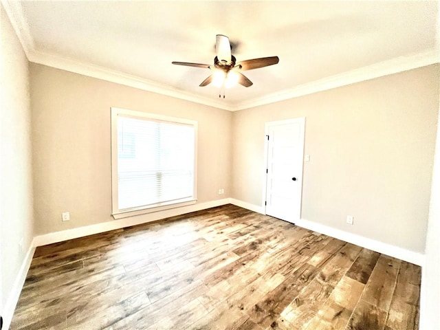 spare room featuring crown molding, hardwood / wood-style floors, and ceiling fan