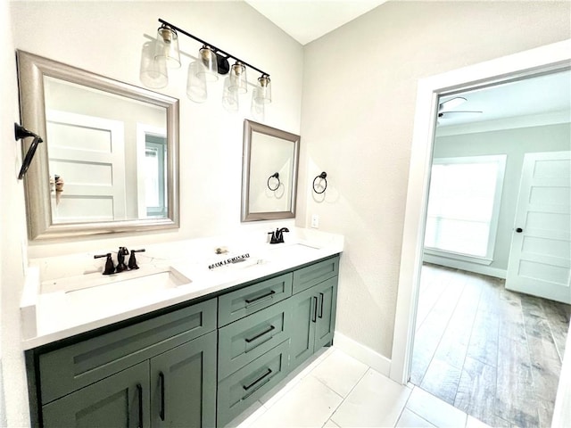 bathroom with hardwood / wood-style floors, vanity, and ceiling fan