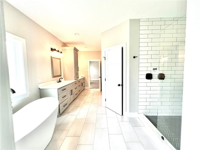 bathroom featuring tile patterned floors, plus walk in shower, and vanity