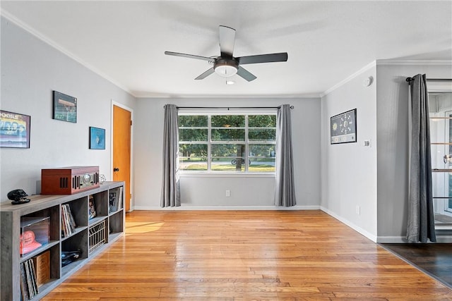 interior space featuring light hardwood / wood-style floors, ceiling fan, and ornamental molding