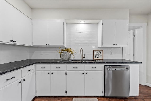 kitchen featuring white cabinetry, dishwasher, sink, and dark stone countertops