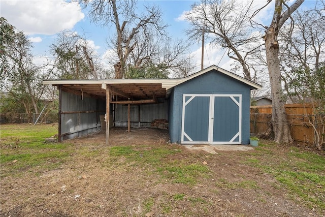 view of outbuilding featuring a lawn