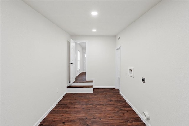 corridor with dark hardwood / wood-style flooring