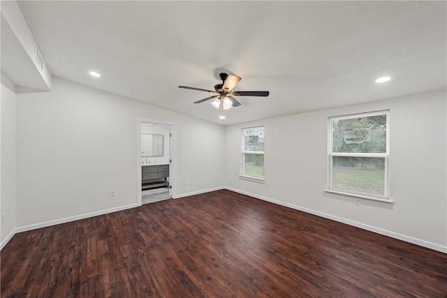 unfurnished living room with lofted ceiling, dark wood-type flooring, and ceiling fan