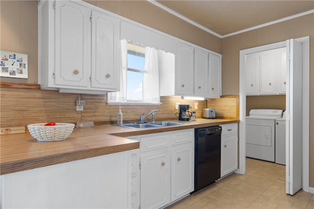 kitchen with sink, washer and clothes dryer, black dishwasher, ornamental molding, and white cabinets