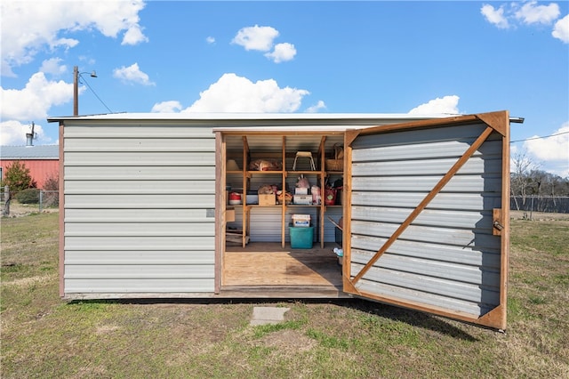 view of outdoor structure with a yard