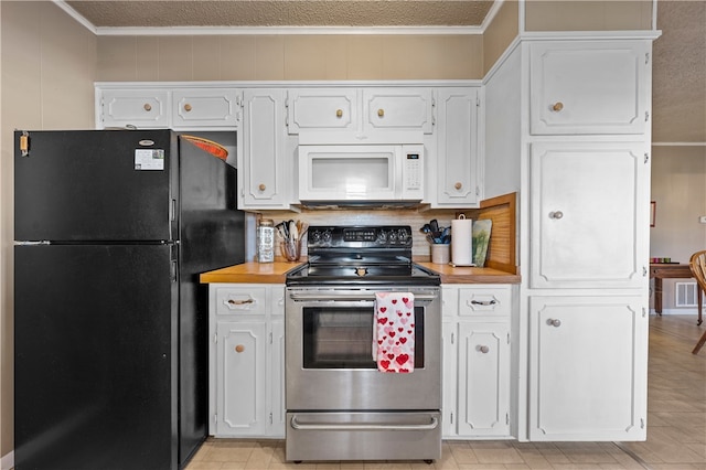 kitchen featuring white cabinetry, stainless steel range with electric stovetop, wooden counters, crown molding, and black refrigerator