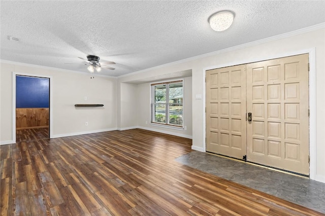 foyer featuring ceiling fan, ornamental molding, dark hardwood / wood-style flooring, and a textured ceiling