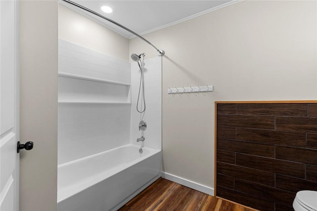 bathroom featuring crown molding, wood-type flooring,  shower combination, and toilet