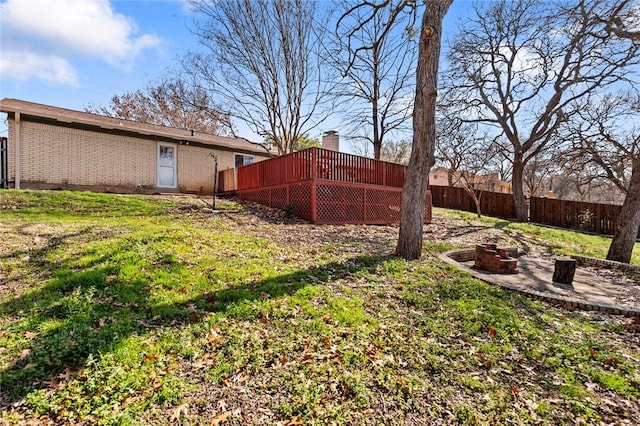 view of yard with an outdoor fire pit