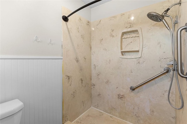 bathroom with walk in shower and toilet