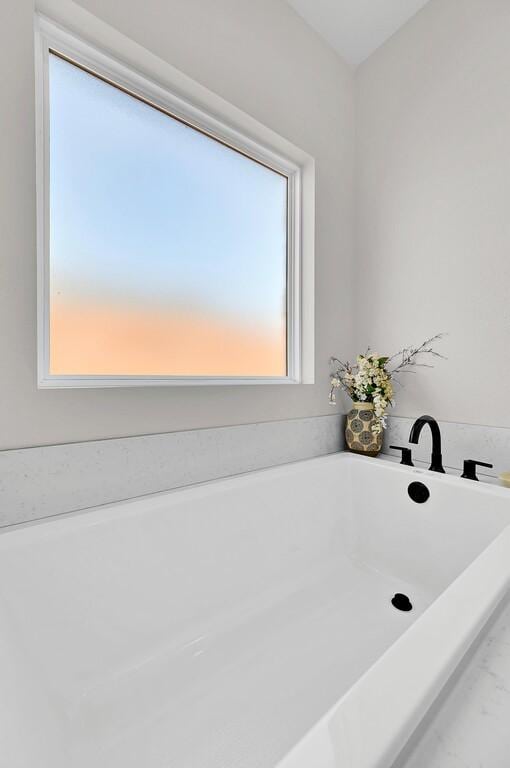 full bathroom with a soaking tub