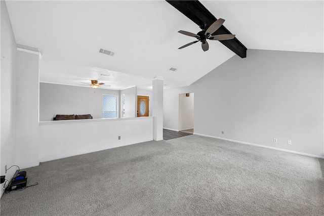 unfurnished living room featuring vaulted ceiling with beams and carpet floors