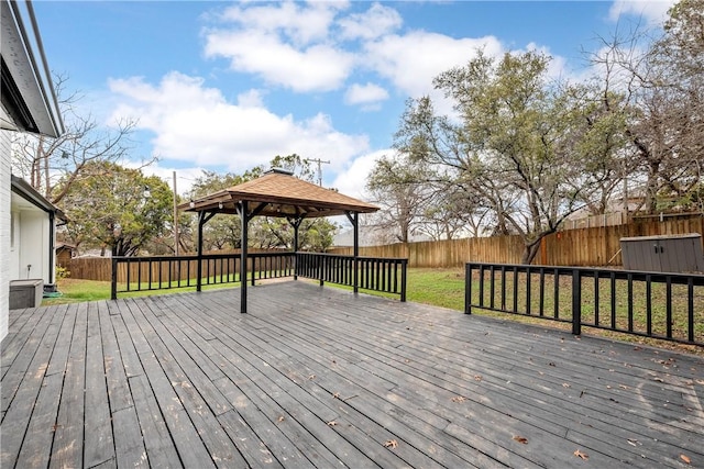 deck featuring a lawn and a gazebo