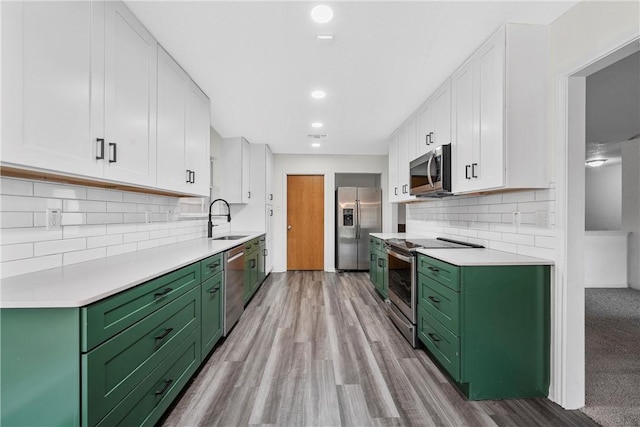 kitchen with white cabinetry, sink, and appliances with stainless steel finishes