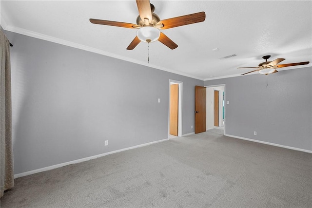 spare room with light colored carpet and ornamental molding