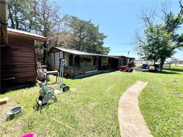 view of yard with an outdoor structure