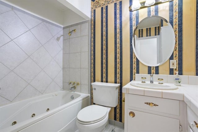 full bathroom with vanity, toilet, and tiled shower / bath