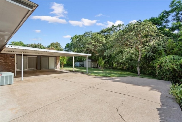 view of patio / terrace with a carport and cooling unit