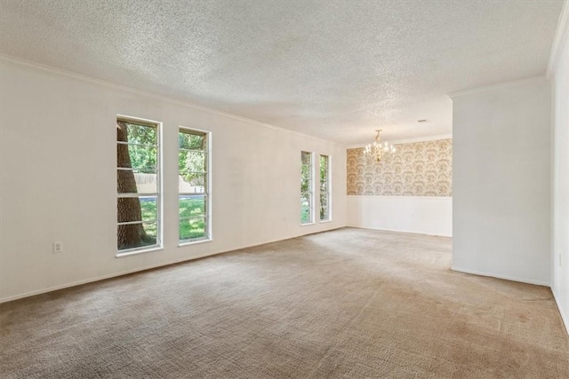 empty room featuring carpet floors, a textured ceiling, and a notable chandelier