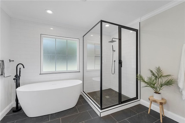 bathroom with tile patterned floors, ornamental molding, and shower with separate bathtub