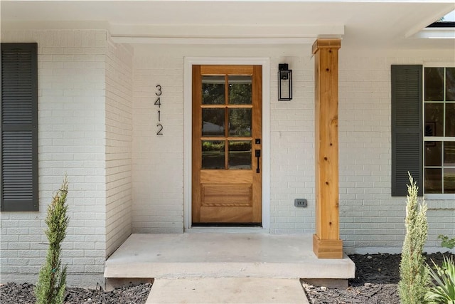 doorway to property with covered porch