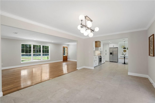 unfurnished living room with a chandelier, ornamental molding, and light hardwood / wood-style flooring