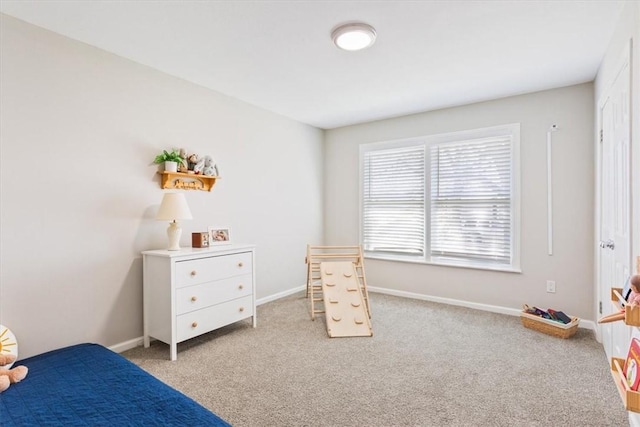 bedroom featuring baseboards and carpet floors