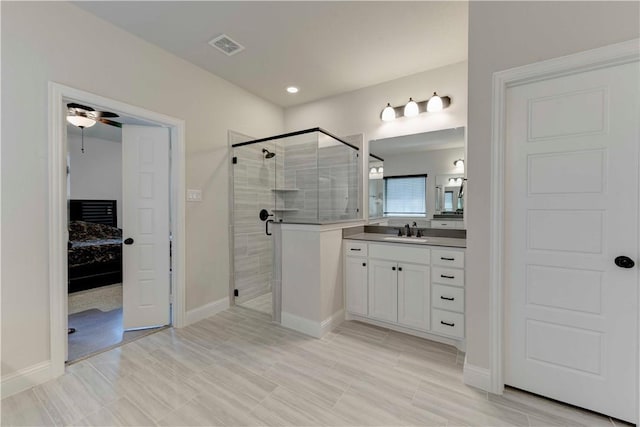 bathroom with ceiling fan, hardwood / wood-style floors, vanity, and a shower with shower door