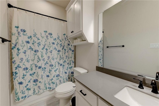 full bathroom with shower / bath combo with shower curtain, vanity, and toilet