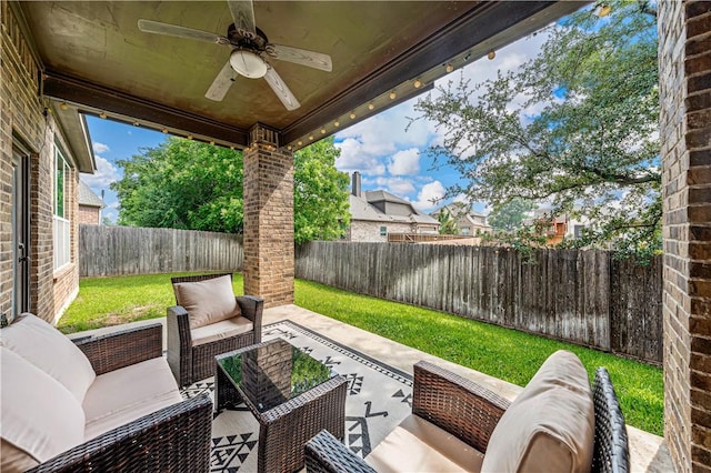 view of patio with an outdoor living space and ceiling fan