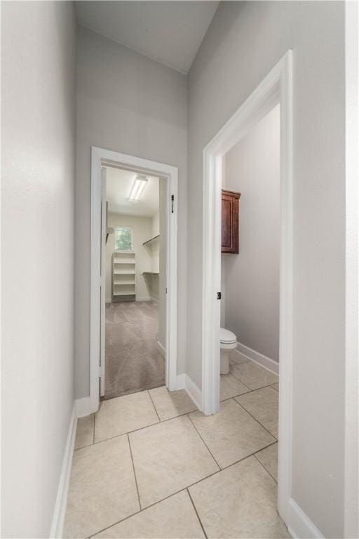 hallway with light tile patterned floors