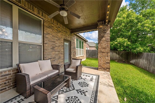 view of patio featuring ceiling fan and an outdoor living space