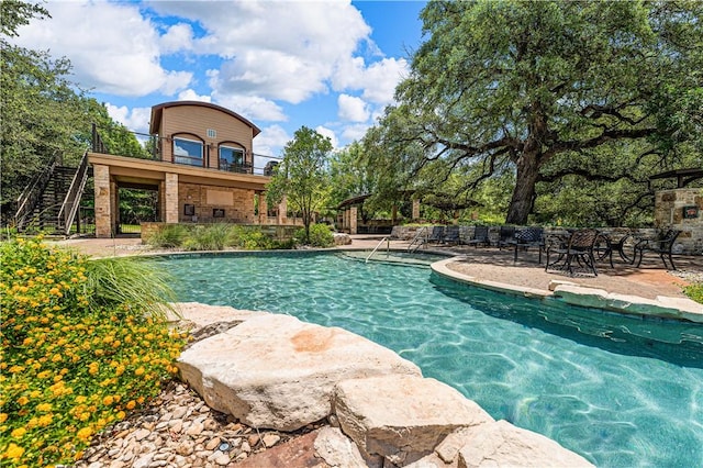 view of pool featuring a patio