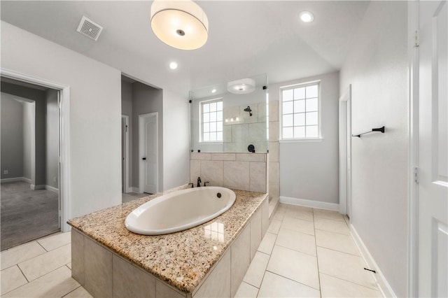 bathroom featuring separate shower and tub and tile patterned flooring