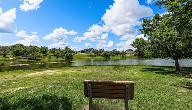 surrounding community featuring a yard and a water view