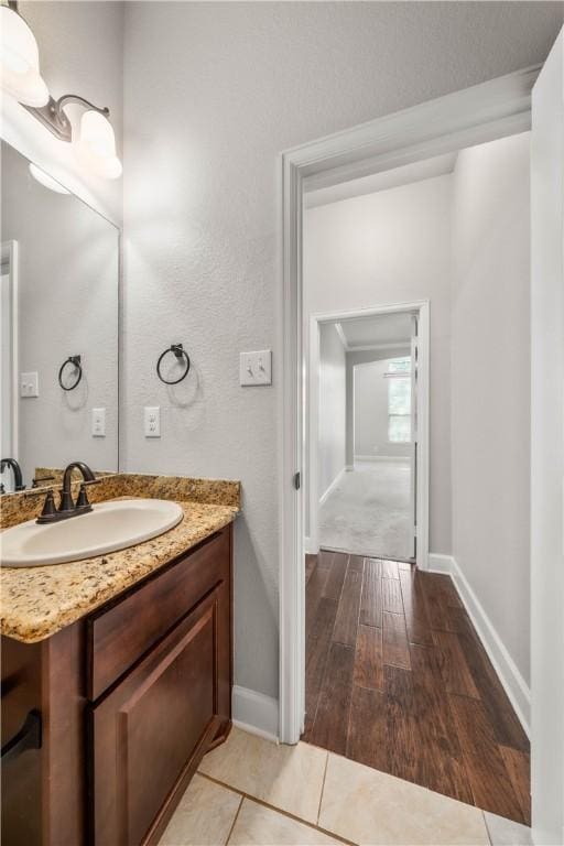 bathroom featuring wood-type flooring and vanity