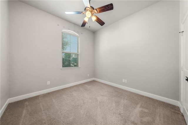 empty room with carpet flooring and ceiling fan