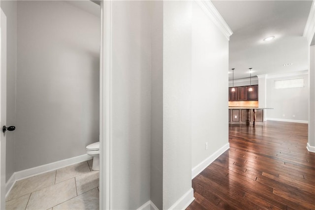 interior space with dark hardwood / wood-style floors and ornamental molding