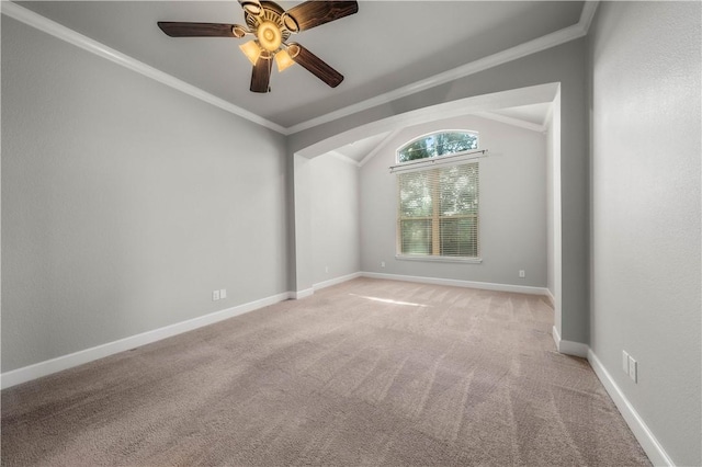 carpeted empty room with lofted ceiling, ceiling fan, and crown molding