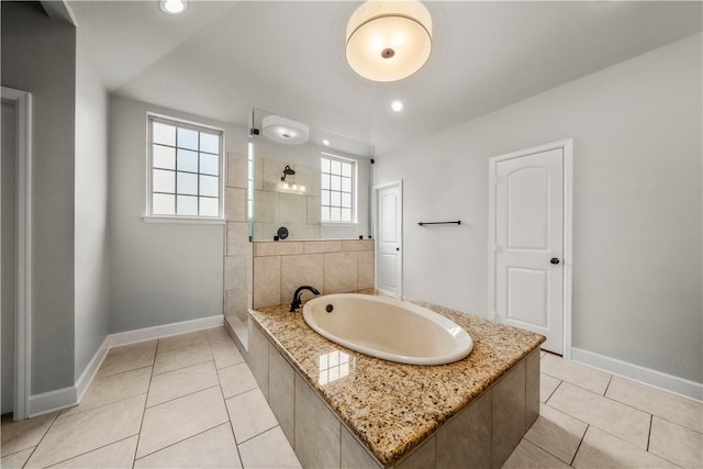 bathroom featuring tile patterned floors and independent shower and bath