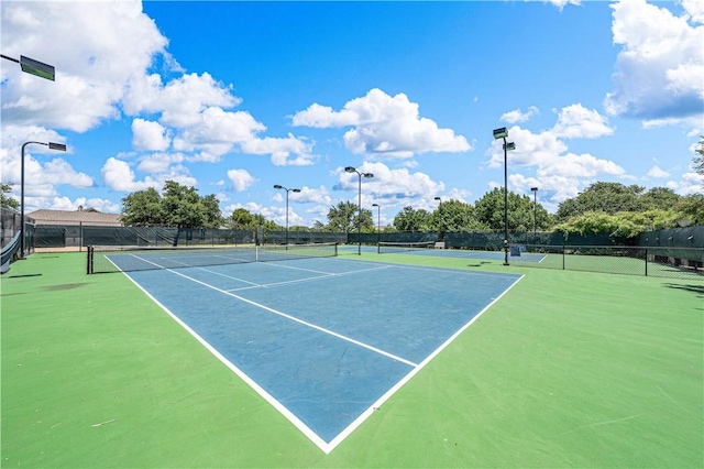 view of sport court featuring basketball hoop