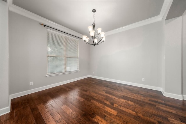 empty room featuring dark hardwood / wood-style flooring, crown molding, and a notable chandelier