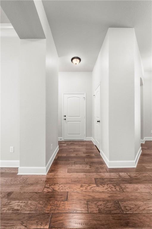 corridor featuring dark hardwood / wood-style flooring