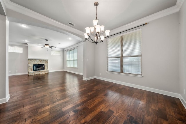 unfurnished living room featuring ceiling fan with notable chandelier, dark hardwood / wood-style floors, ornamental molding, and a fireplace