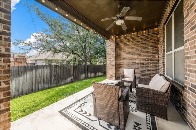 view of patio featuring ceiling fan